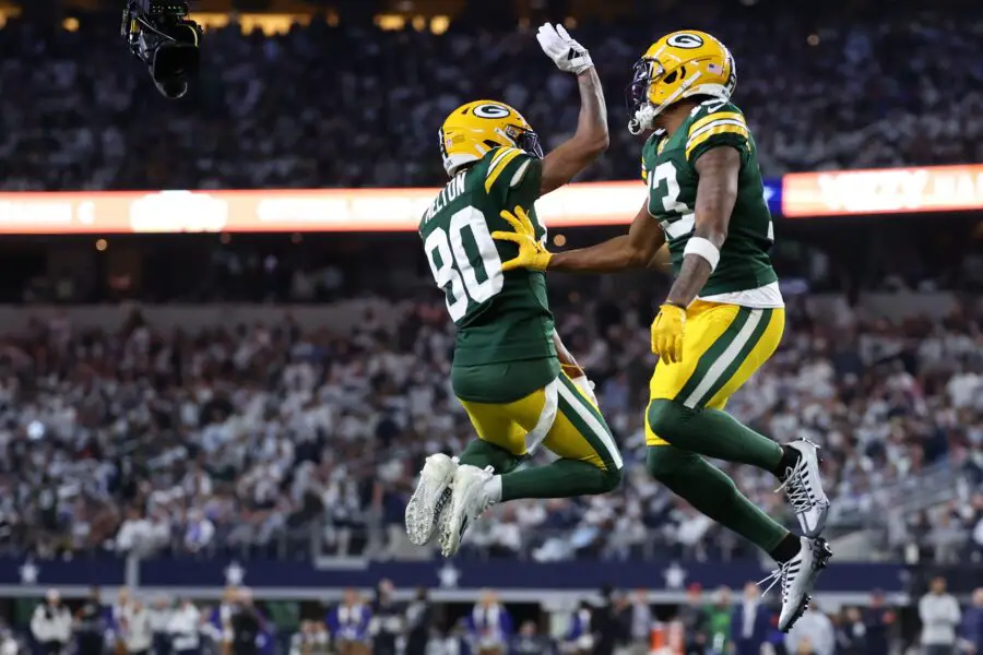 Jan 14, 2024; Arlington, Texas, USA;Green Bay Packers wide receiver Dontayvion Wicks (13) reacts with wide receiver Bo Melton (80) after a touchdown catch against the Dallas Cowboys in the first half of the 2024 NFC wild card game at AT&T Stadium. Mandatory Credit: Kevin Jairaj-USA TODAY Sports