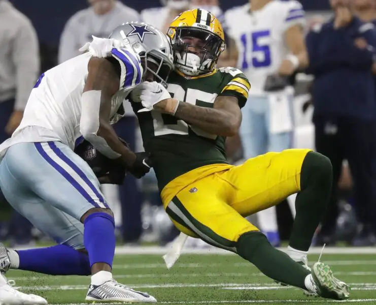Jan 14, 2024; Arlington, Texas, USA; Green Bay Packers cornerback Keisean Nixon (25) tackles Dallas Cowboys wide receiver Brandin Cooks (3) during the fourth quarter in a 2024 NFC wild card game at AT&T Stadium. Mandatory Credit: Wm. Glasheen-USA TODAY Sports