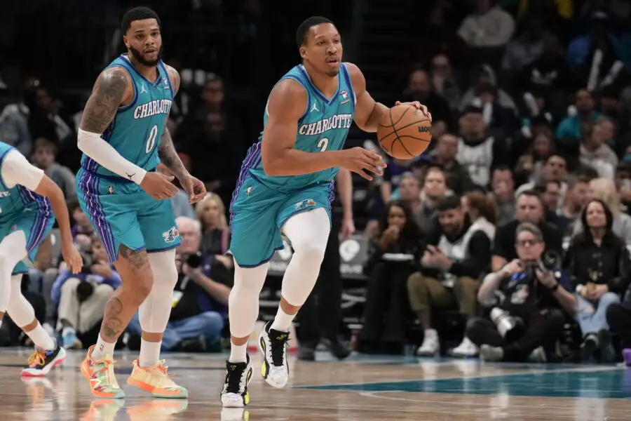 Feb 29, 2024; Charlotte, North Carolina, USA; Charlotte Hornets forward Grant Williams (2) brings the ball up court against the Milwaukee Bucks during the second half at Spectrum Center. Mandatory Credit: Jim Dedmon-USA TODAY Sports