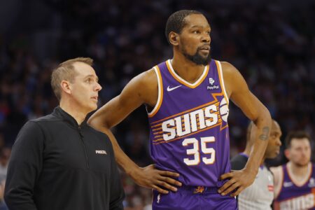 Apr 14, 2024; Minneapolis, Minnesota, USA; Phoenix Suns head coach Frank Vogel speaks with forward Kevin Durant (35) during a free throw by the Minnesota Timberwolves in the third quarter at Target Center. Mandatory Credit: Bruce Kluckhohn-USA TODAY Sports