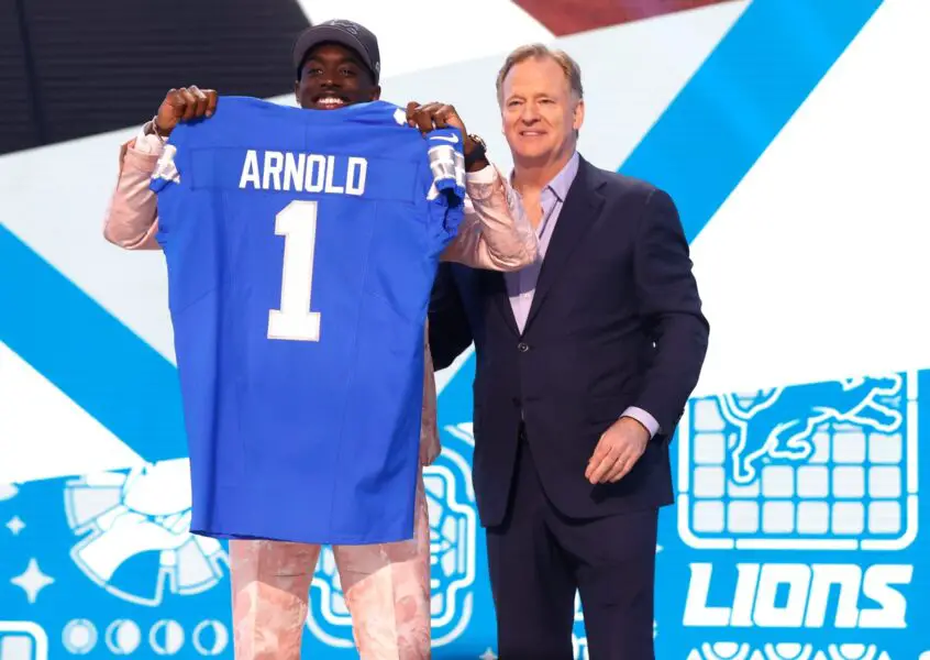 Terrion Arnold, a cornerback from the University of Alabama, shows off his Detroit Lions jersey with NFL commissioner Roger Goodell after he was picked in the first round of the 2024 NFL draft at the NFL draft theater in Detroit on Thursday, April 25, 2024. © Eric Seals / USA TODAY NETWORK