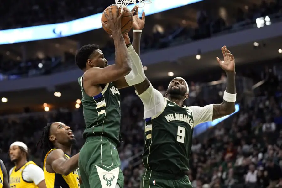 Apr 30, 2024; Milwaukee, Wisconsin, USA; Milwaukee Bucks guard Malik Beasley (5) and forward Bobby Portis (9) reach for a rebound during the fourth quarter against the Indiana Pacers during game five of the first round for the 2024 NBA playoffs at Fiserv Forum. Mandatory Credit: Jeff Hanisch-USA TODAY Sports