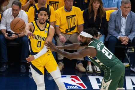 May 2, 2024; Indianapolis, Indiana, USA; Indiana Pacers guard Tyrese Haliburton (0) passes the ball while Milwaukee Bucks guard Patrick Beverley (21) defends during game six of the first round for the 2024 NBA playoffs at Gainbridge Fieldhouse. Mandatory Credit: Trevor Ruszkowski-USA TODAY Sports
