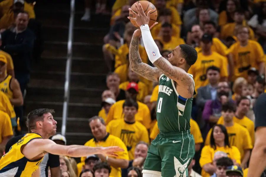 May 2, 2024; Indianapolis, Indiana, USA; Milwaukee Bucks guard Damian Lillard (0) shoots the ball while Indiana Pacers guard T.J. McConnell (9) defends during game six of the first round for the 2024 NBA playoffs at Gainbridge Fieldhouse. Mandatory Credit: Trevor Ruszkowski-USA TODAY Sports