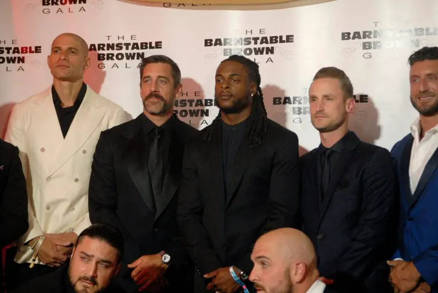 Aaron Rodgers and his football player friends pose on the red carpet at the 35th annual Barnstable Brown Gala on Friday night. May 03, 2024 © Maggie Huber/Special to Courier Journal / USA TODAY NETWORK