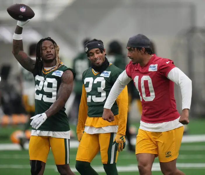Quarterback Jordan Love (10) jokes around with cornerback Jaire Alexander (23) and safety Xavier McKinney (29) during organized team activities for the Green Bay Packers Tuesday, May 21, 2024 in Green Bay, Wisconsin.