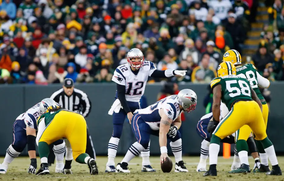 Nov 30, 2014; Green Bay, WI, USA; New England Patriots quarterback Tom Brady (12) during the game against the Green Bay Packers at Lambeau Field. Mandatory Credit: Chris Humphreys-USA TODAY Sports