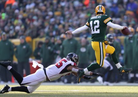 Green Bay Packers quarterback Aaron Rodgers eludes Atlanta Falcons defensive tackle Jack Crawford during their football game on Sunday, December 9, 2018, at Lambeau Field in Green Bay, Wis. Wm. Glasheen/USA TODAY NETWORK-Wisconsin.