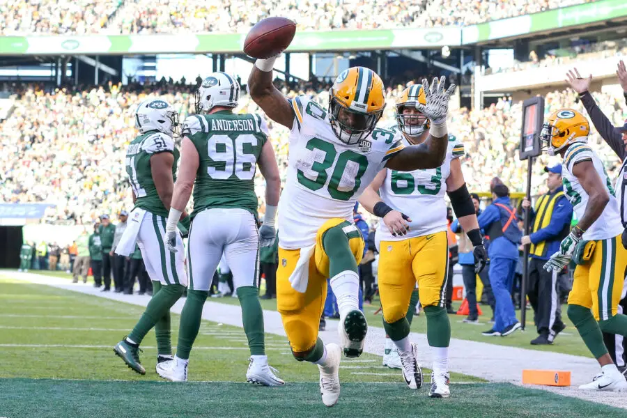 Dec 23, 2018; East Rutherford, NJ, USA; Green Bay Packers running back Jamaal Williams (30) celebrates his touchdown in front of New York Jets defensive end Henry Anderson (96) during the first half at MetLife Stadium. Mandatory Credit: Vincent Carchietta-USA TODAY Sports