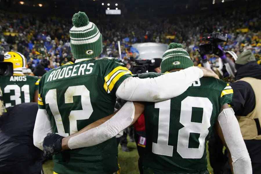 Jan 8, 2023; Green Bay, Wisconsin, USA; Green Bay Packers quarterback Aaron Rodgers (12) and wide receiver Randall Cobb (18) walk off the field following the game against the Detroit Lions at Lambeau Field. Mandatory Credit: Jeff Hanisch-USA TODAY Sports