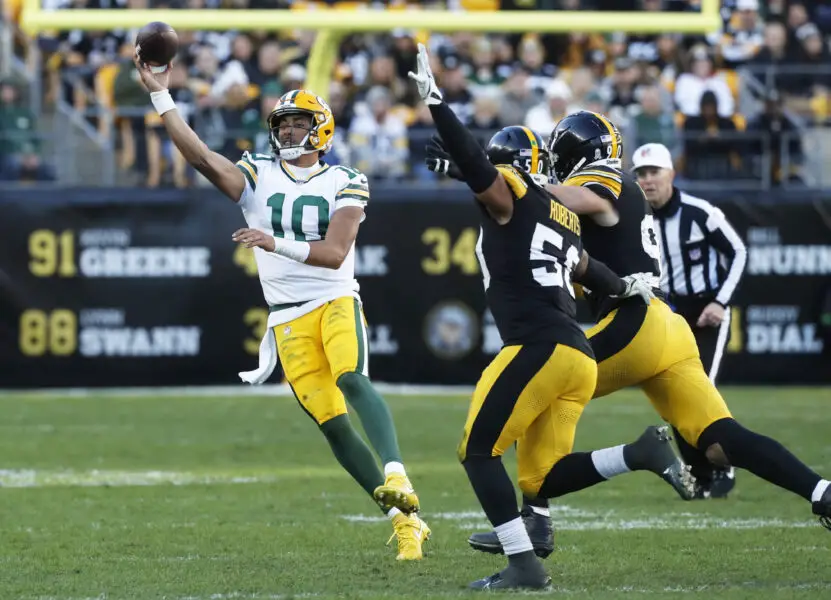 Nov 12, 2023; Pittsburgh, Pennsylvania, USA; Green Bay Packers quarterback Jordan Love (10) passes against pressure from Pittsburgh Steelers linebacker Elandon Roberts (50) and linebacker T.J. Watt (90) during the fourth quarter at Acrisure Stadium. Pittsburgh won 23-19. Mandatory Credit: Charles LeClaire-USA TODAY Sports