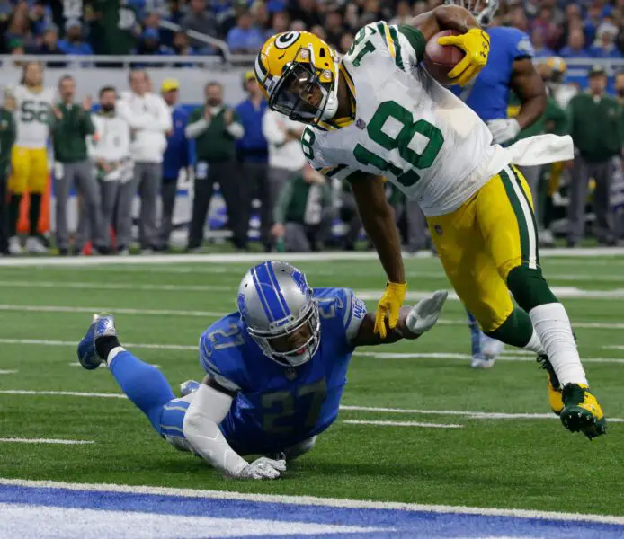 Green Bay Packers wide receiver Randall Cobb (18) scores a touchdown on a 17-yard reception with Detroit Lions free safety Glover Quin (27) in his wake during the fourth quarter of their game on Dec. 31, 2017, at Ford Field in Detroit, Mich. The Detroit Lions beat the Green Bay Packers 35-11.