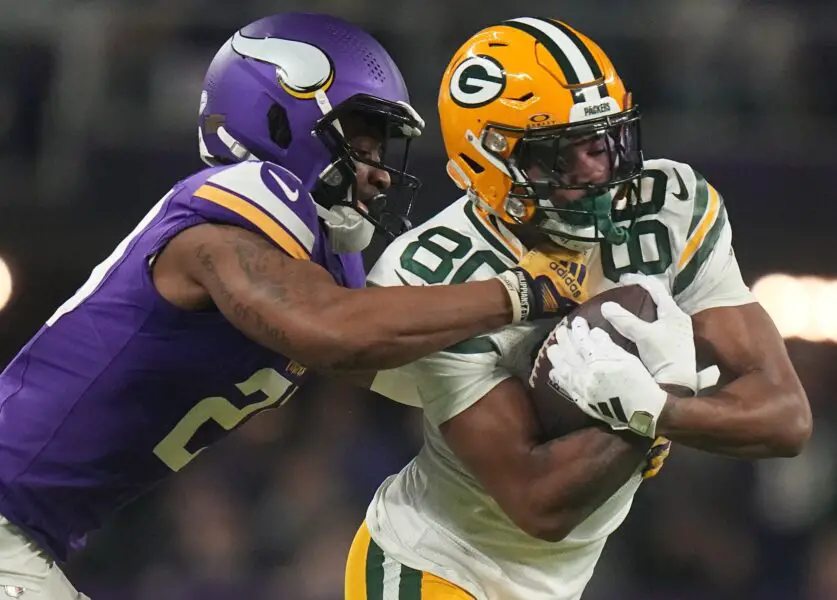 Green Bay Packers wide receiver Bo Melton (80) makes a 12-yard reception before being tackled by Minnesota Vikings cornerback Akayleb Evans (21) during the first quarter of their game Sunday, December 31, 2023 at U.S. Bank Stadium in Minneapolis, Minnesota. © Mark Hoffman/Milwaukee Journal Sentinel / USA TODAY NETWORK