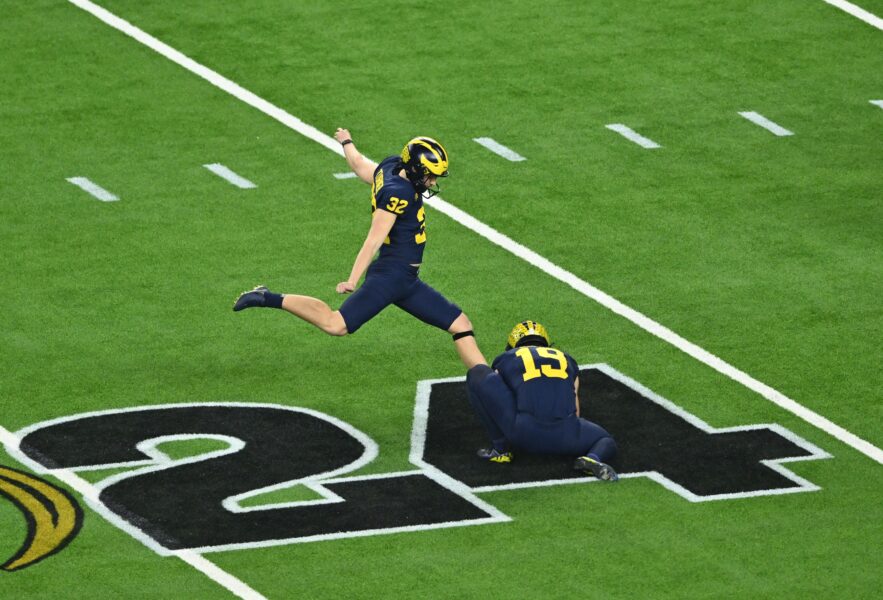 Jan 8, 2024; Houston, TX, USA; Michigan Wolverines place kicker James Turner (32) kicks the ball out of the hold of Tommy Doman (19) during the second quarter against the Washington Huskies in the 2024 College Football Playoff national championship game at NRG Stadium. Mandatory Credit: Maria Lysaker-USA TODAY Sports (Green Bay Packers)