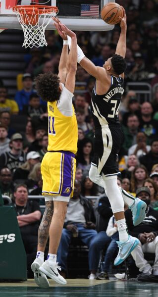 Mar 26, 2024; Milwaukee, Wisconsin, USA; Milwaukee Bucks forward Giannis Antetokounmpo (34) puts up a shot against Los Angeles Lakers center Jaxson Hayes (11) in the second half at Fiserv Forum. Mandatory Credit: Michael McLoone-USA TODAY Sports