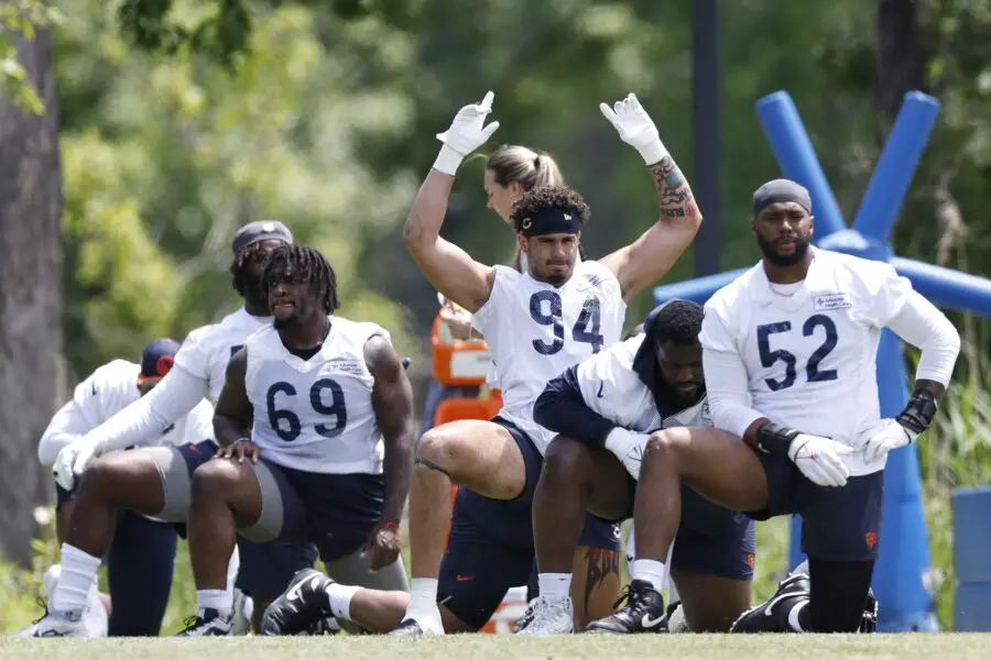 May 31, 2024; Lake Forest, IL, USA; Chicago Bears defensive lineman Austin Booker (94) warms up during organized team activities at Halas Hall. Mandatory Credit: Kamil Krzaczynski-USA TODAY Sports (Green Bay Packers)