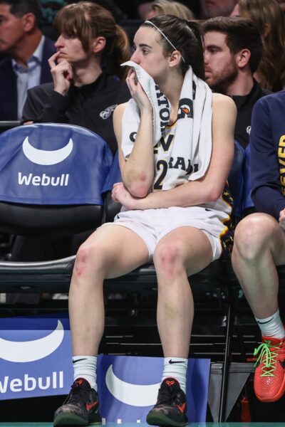 Jun 2, 2024; Brooklyn, New York, USA; Indiana Fever guard Caitlin Clark (22) watches from the bench in the fourth quarter against the New York Liberty at Barclays Center. Mandatory Credit: Wendell Cruz-USA TODAY Sports