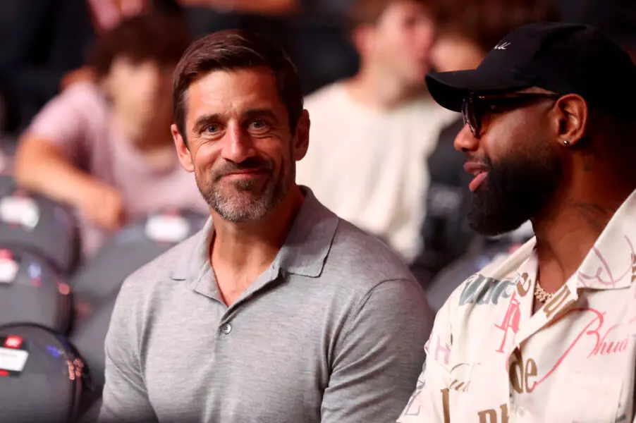 Jun 29, 2024; Las Vegas, Nevada, USA; New York Jets quarterback Aaron Rodgers and Chicago Bears tight end Marcedes Lewis during UFC 303 at T-Mobile Arena. Mandatory Credit: Mark J. Rebilas-USA TODAY Sports