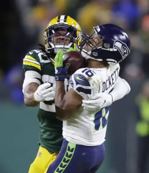 Green Bay Packers cornerback Kevin King (20) puts a hit on Seattle Seahawks wide receiver Tyler Lockett (16) during their NFC divisional round playoff football game Sunday, January 12, 2020, at Lambeau Field in Green Bay, Wis. © Dan Powers/USA TODAY NETWORK-Wis, Appleton Post-Crescent via Imagn Content Services, LLC