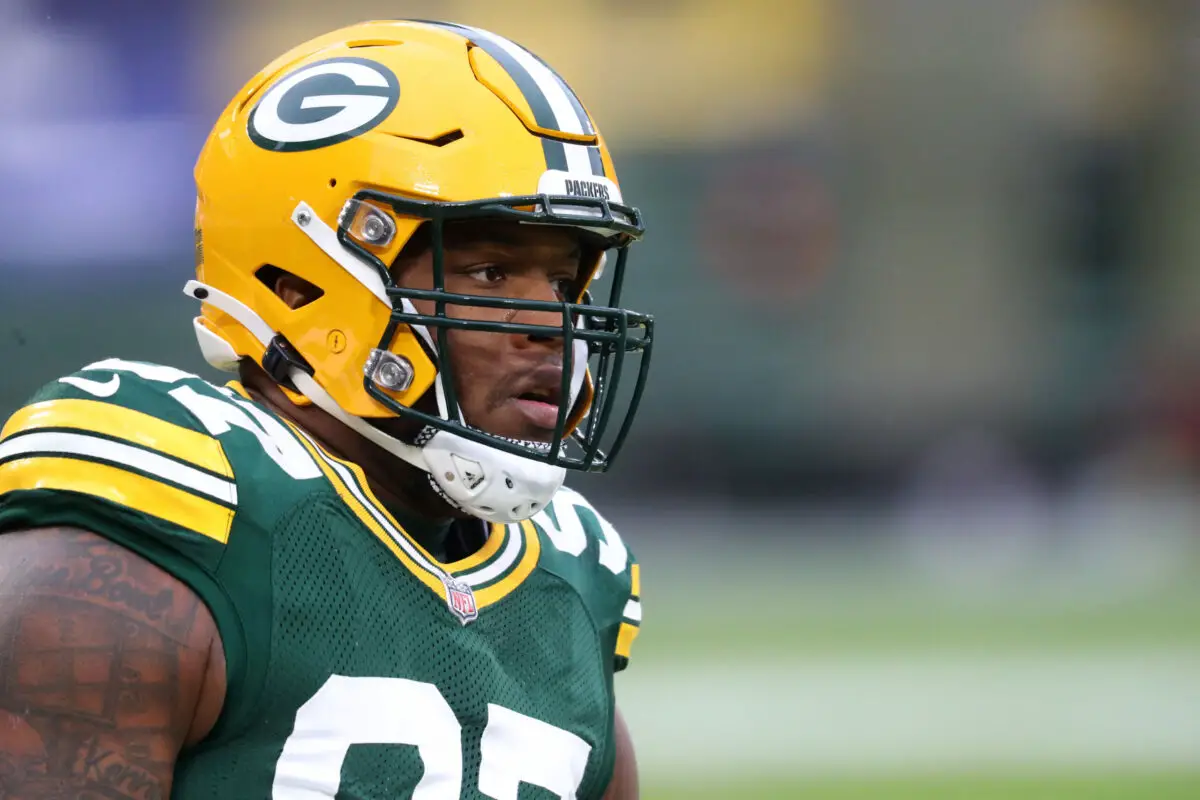 Jan 16, 2021; Green Bay, Wisconsin, USA; Green Bay Packers defensive tackle Kenny Clark (97) against the Los Angeles Rams during the NFC Divisional Round at Lambeau Field. Mandatory Credit: Mark J. Rebilas-USA TODAY Sports