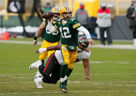Jan 24, 2021; Green Bay, Wisconsin, USA; Green Bay Packers quarterback Aaron Rodgers (12) during the NFC Championship game against the Tampa Bay Buccaneers at Lambeau Field. Mandatory Credit: Jeff Hanisch-USA TODAY Sports
