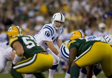 Aug 26, 2010; Green Bay, WI, USA; Indianapolis Colts quarterback Peyton Manning (18) waits under center prior to a play during the game against the Green Bay Packers at Lambeau Field. The Packers defeated the Colts 59-24. Mandatory Credit: Jeff Hanisch-USA TODAY Sports
