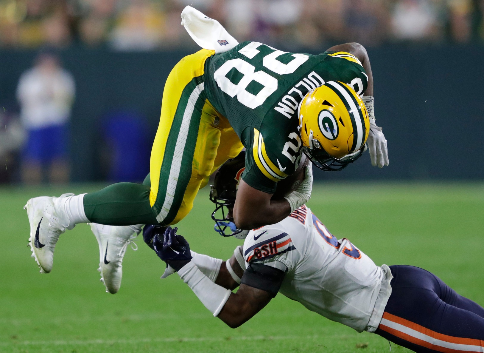 Green Bay Packers running back AJ Dillon (28) runs for a first down against Chicago Bears safety Jaquan Brisker (9) in the third quarter during their football game Sunday, September 18, 2022, at Lambeau Field in Green Bay, Wis. Dan Powers/USA TODAY NETWORK-Wisconsin