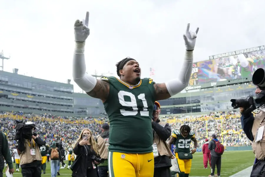 Oct 13, 2024; Green Bay, Wisconsin, USA; Green Bay Packers defensive lineman Preston Smith (91) celebrates following the game against the Arizona Cardinals at Lambeau Field. Mandatory Credit: Jeff Hanisch-Imagn Images