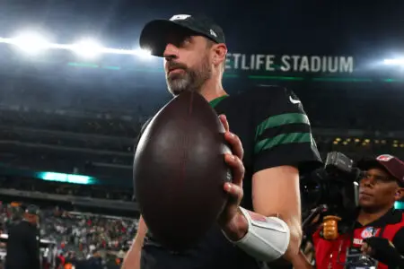 Oct 31, 2024; East Rutherford, New Jersey, USA; New York Jets wide receiver Davante Adams (17), quarterback Aaron Rodgers (8) and interim head coach Jeff Ulbrich celebrate Adams touchdown against the Houston Texans during the second half at MetLife Stadium. Mandatory Credit: Ed Mulholland-Imagn Images