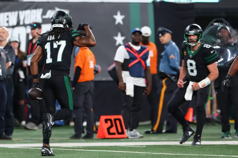 Oct 31, 2024; East Rutherford, New Jersey, USA; New York Jets wide receiver Davante Adams (17) and New York Jets quarterback Aaron Rodgers (8) celebrate a touchdown against the Houston Texans during the second half at MetLife Stadium. Mandatory Credit: Ed Mulholland-Imagn Images