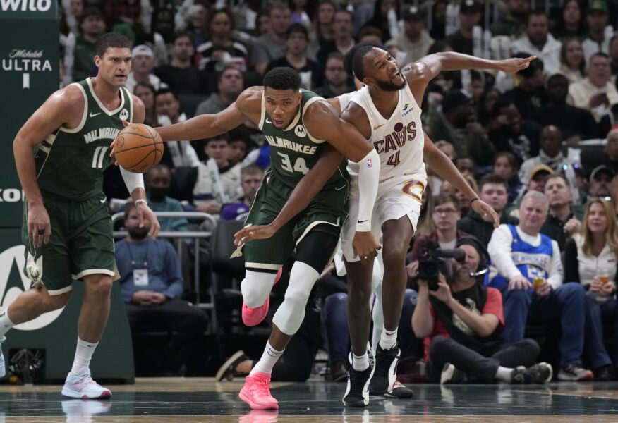 Nov 2, 2024; Milwaukee, Wisconsin, USA; Milwaukee Bucks forward Giannis Antetokounmpo (34)and Cleveland Cavaliers forward Evan Mobley (4) get tangled up in the second half at Fiserv Forum. Mandatory Credit: Michael McLoone-Imagn Images