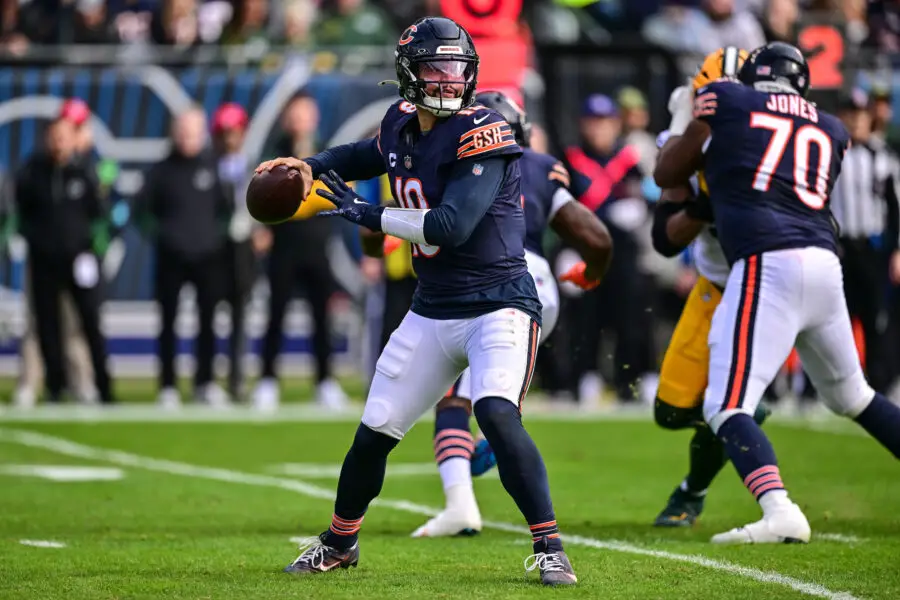 Nov 17, 2024; Chicago, Illinois, USA; Chicago Bears quarterback Caleb Williams (18) looks to pass against the Green Bay Packers during the second quarter at Soldier Field. Mandatory Credit: Daniel Bartel-Imagn Images