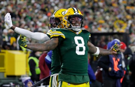 Green Bay Packers running back Josh Jacobs (8) celebrates scoring a touchdown with wide receiver Bo Melton (80) against the San Francisco 49ers during their football game Sunday, November 24, 2024, at Lambeau Field in Green Bay, Wisconsin. © Dan Powers/USA TODAY NETWORK-Wisconsin / USA TODAY NETWORK via Imagn Images