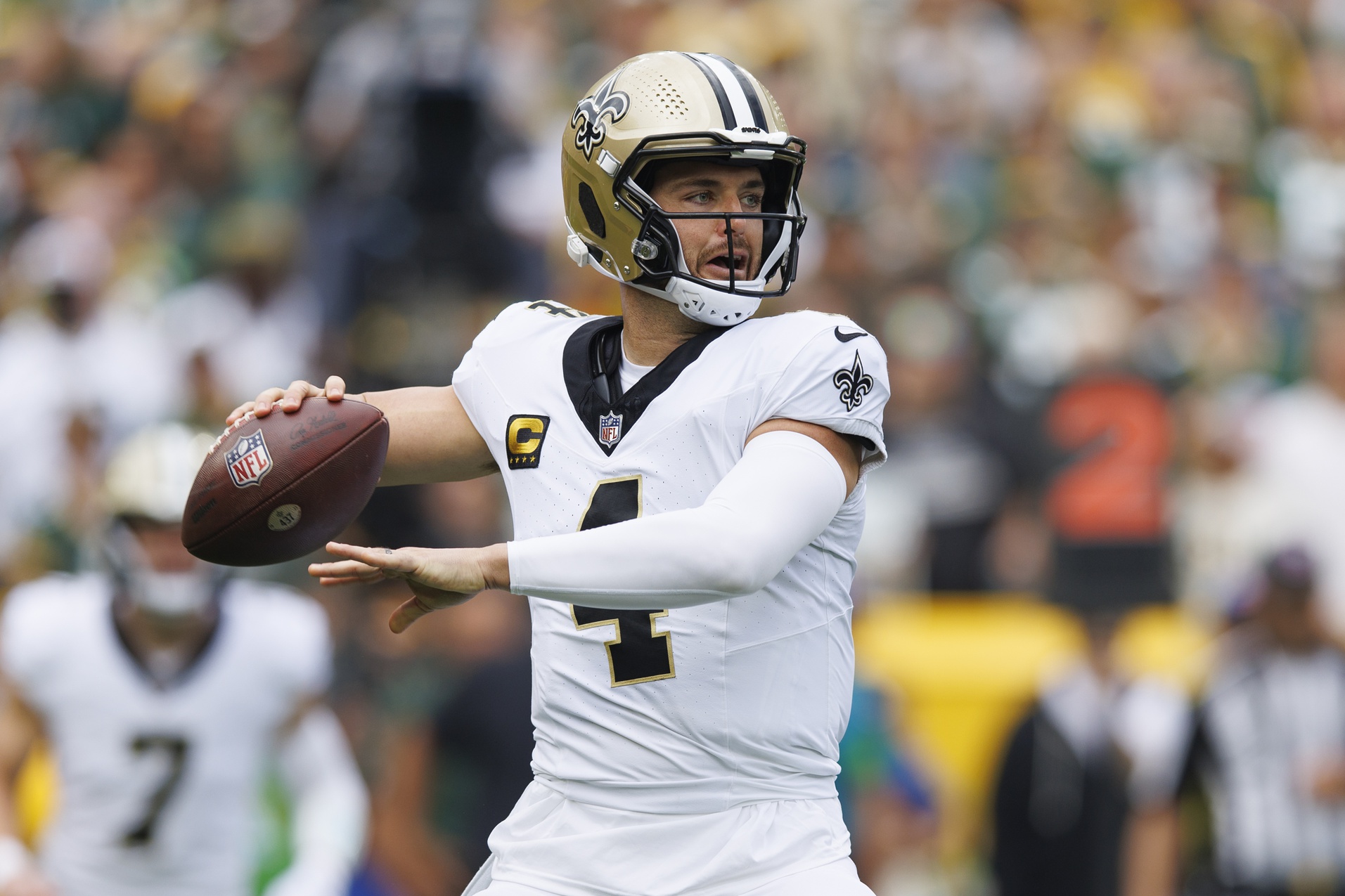 Sep 24, 2023; Green Bay, Wisconsin, USA; New Orleans Saints quarterback Derek Carr (4) throws a pass during the first quarter against the Green Bay Packers at Lambeau Field. Mandatory Credit: Jeff Hanisch-Imagn Images