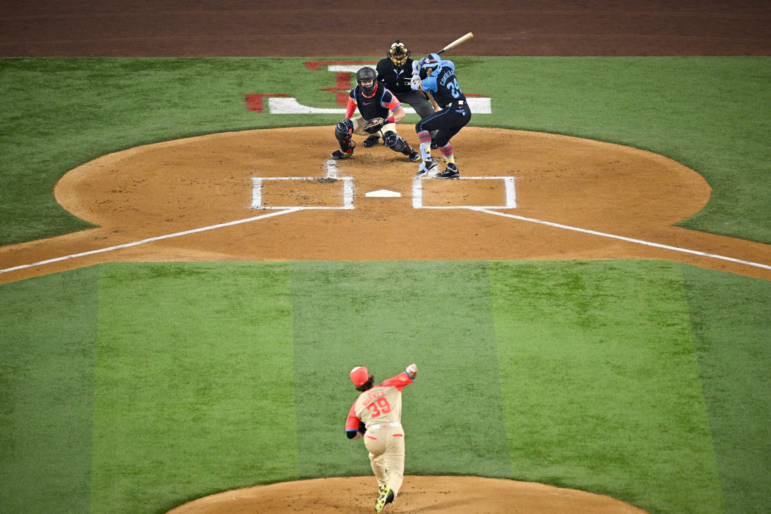 Jul 16, 2024; Arlington, Texas, USA; American League pitcher Corbin Burnes of the Baltimore Orioles (39) throws to National League catcher William Contreras of the Milwaukee Brewers (24) during the first inning of the 2024 MLB All-Star game at Globe Life Field. Mandatory Credit: Jerome Miron-Imagn Images