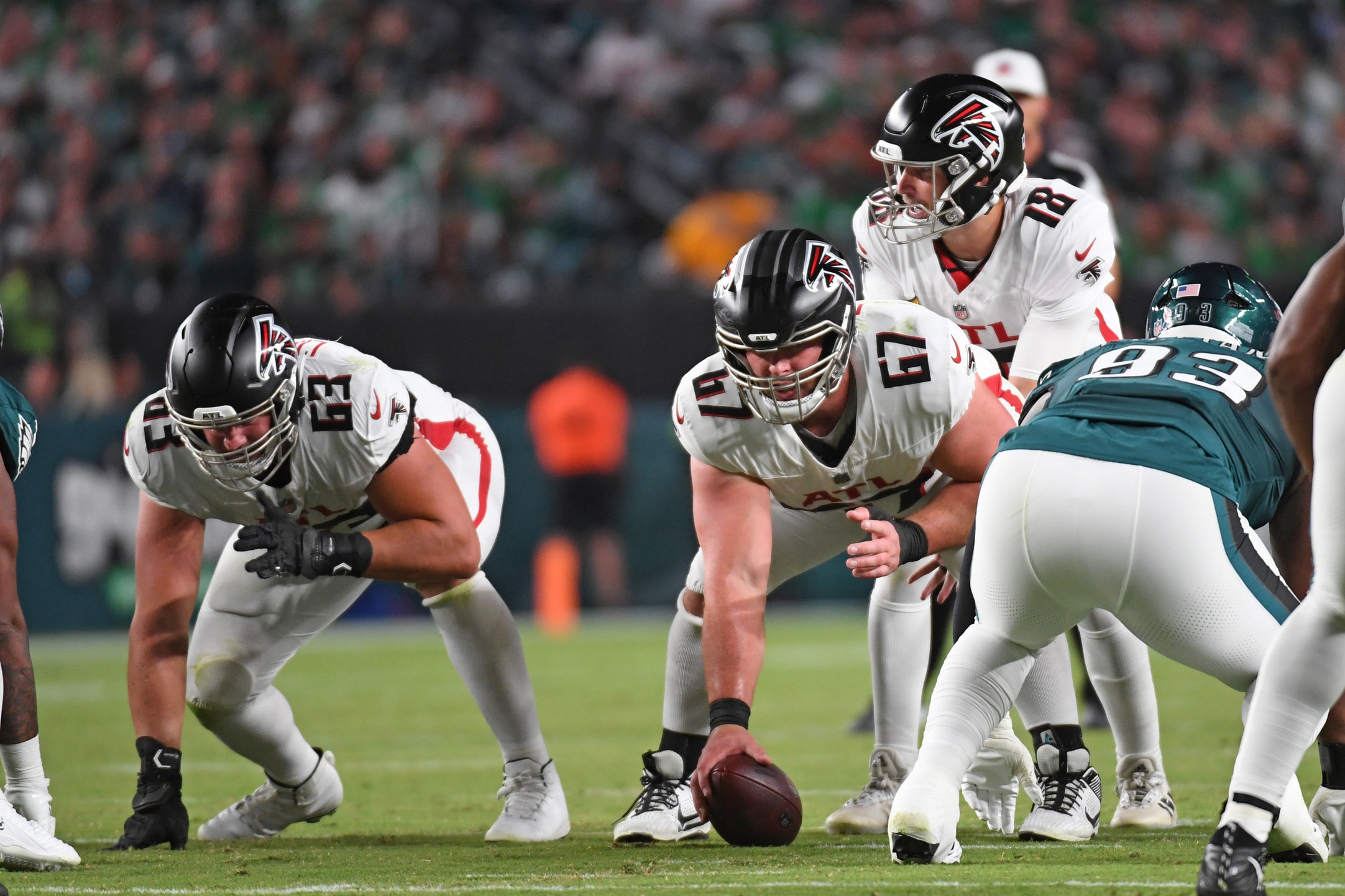 Sep 16, 2024; Philadelphia, Pennsylvania, USA; Atlanta Falcons guard Chris Lindstrom (63) and center Drew Dalman (67) lineup with quarterback Kirk Cousins (18) against the Philadelphia Eagles at Lincoln Financial Field. Mandatory Credit: Eric Hartline-Imagn Images