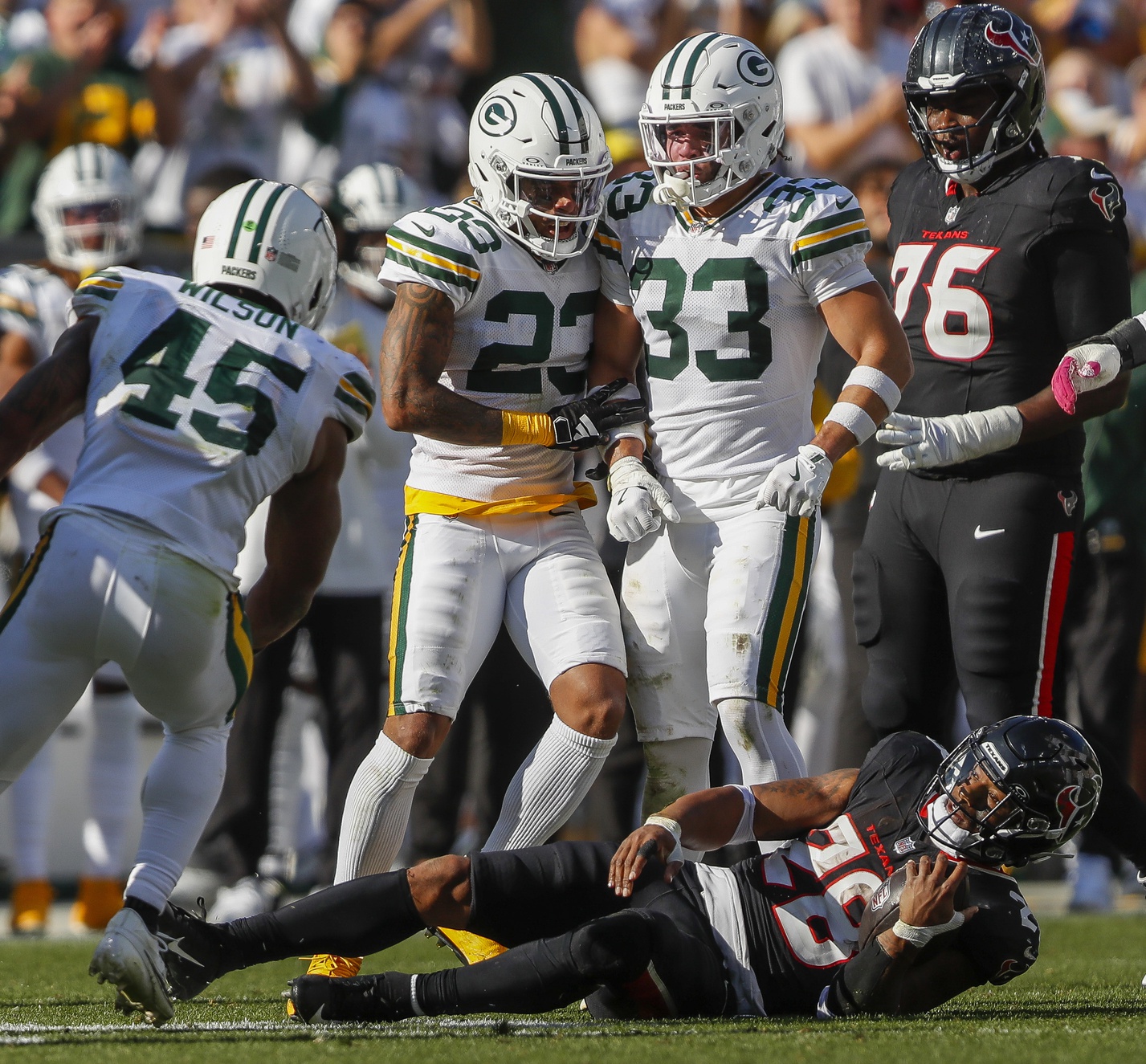 Oct 20, 2024; Green Bay, Wisconsin, USA;  Green Bay Packers cornerback Jaire Alexander (23) talks trash to Houston Texans running back Joe Mixon (28) after a play  at Lambeau Field. Mandatory Credit: Tork Mason/Green Bay Press-Gazette via the USA TODAY NETWORK-Wisconsin-Imagn Images