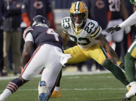 Green Bay Packers cornerback Jaire Alexander (23) tackles Chicago Bears running back D'Andre Swift (4)