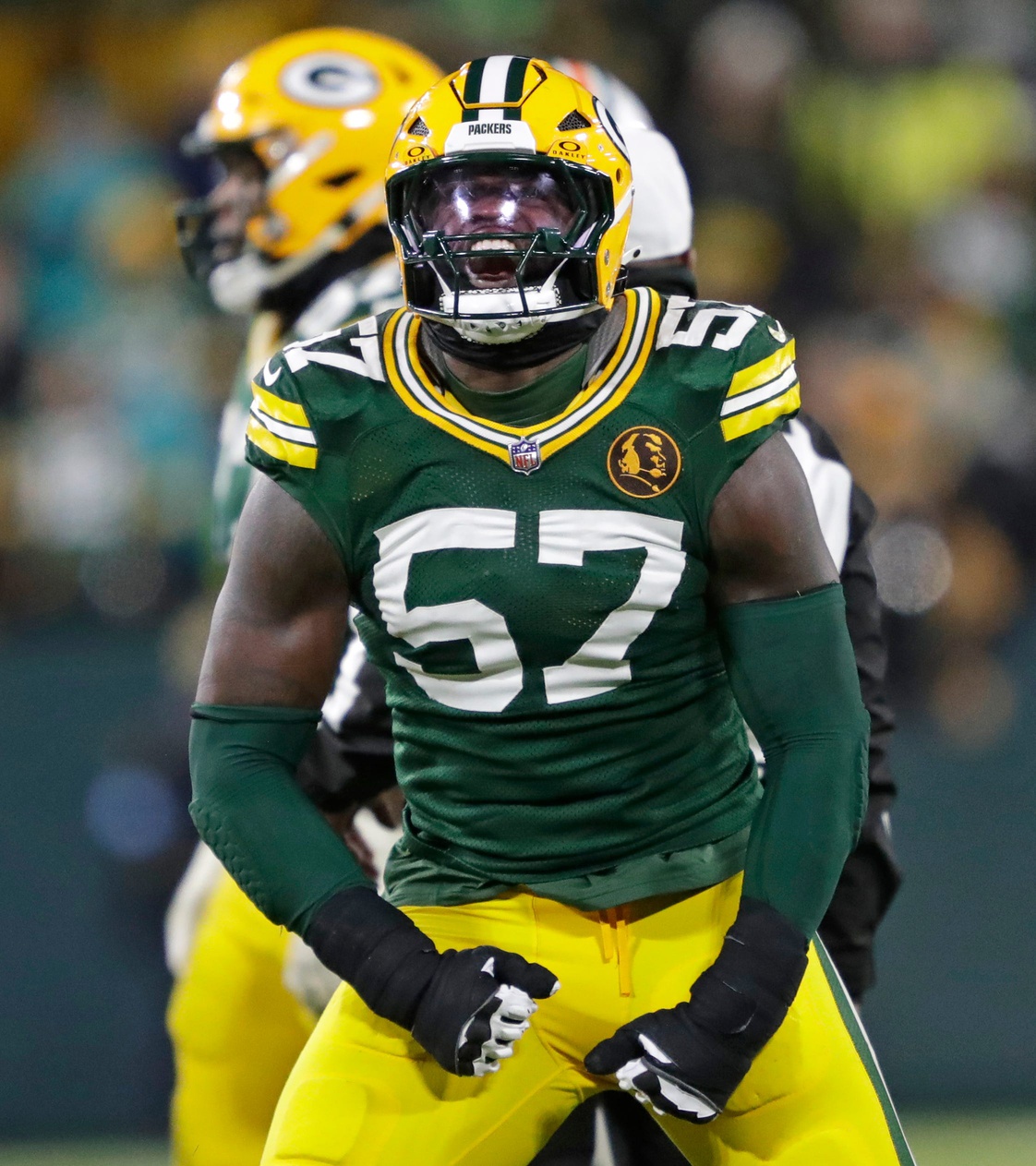 Green Bay Packers defensive end Brenton Cox Jr. (57) celebrates sacking Miami Dolphins quarterback Tua Tagovailoa in the final moments of the football game during Thursday, November 28, 2024, at Lambeau Field in Green Bay, Wisconsin.