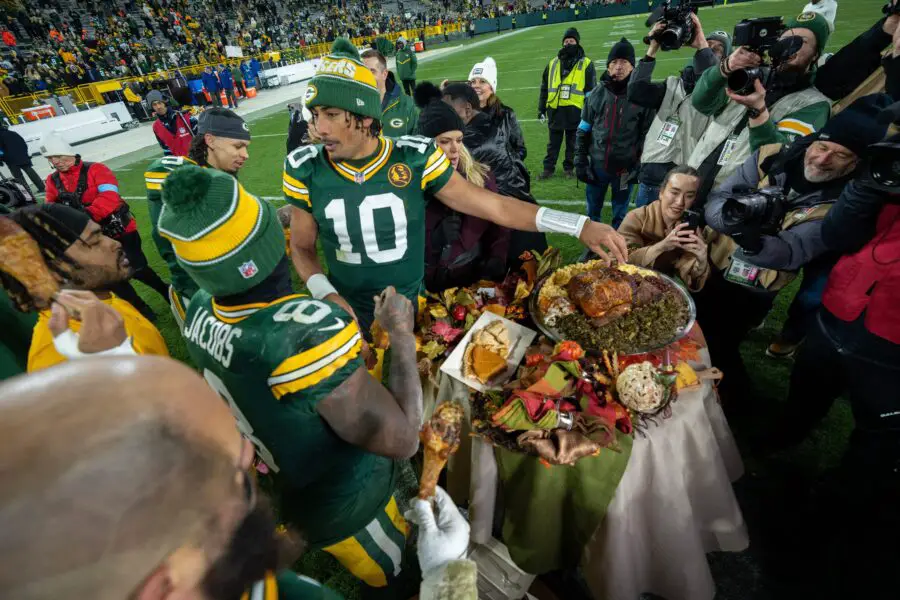 Green Bay Packers Jordan Love with a turkey