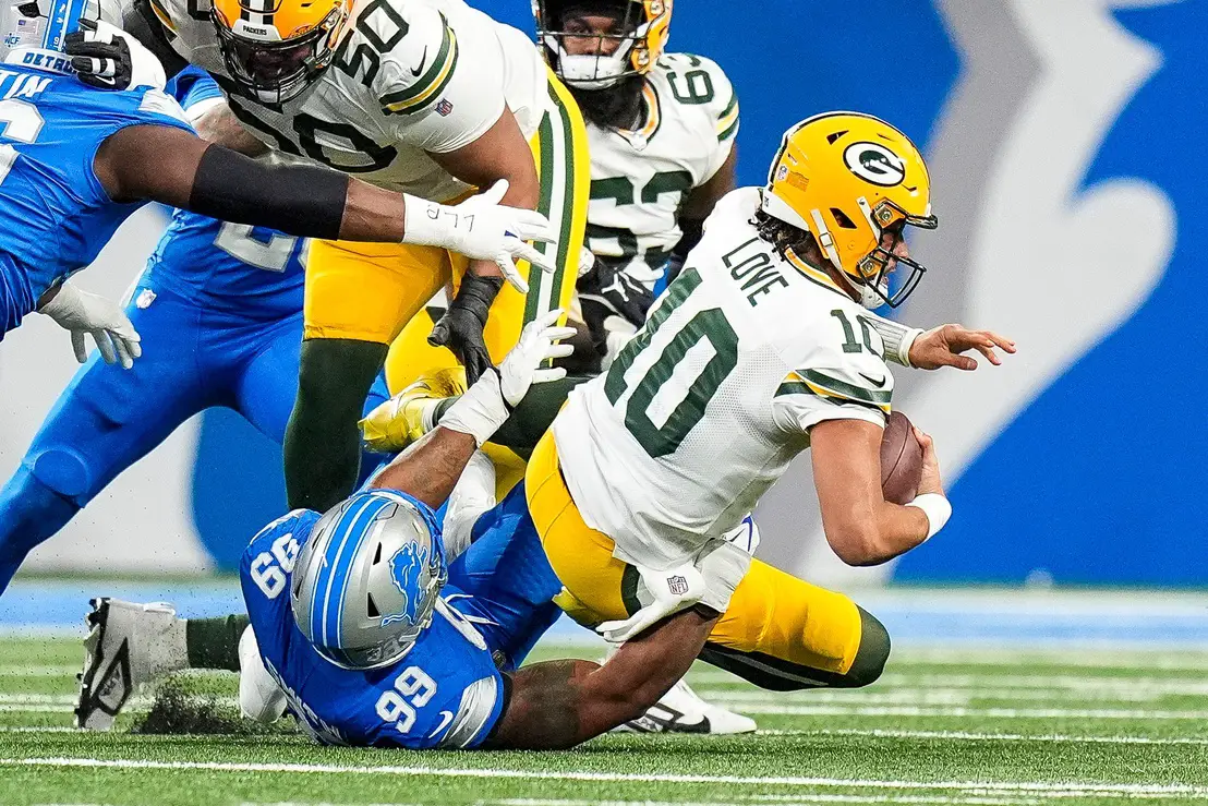 Detroit Lions defensive end Za'Darius Smith (99) sacks Green Bay Packers quarterback Jordan Love (10) during the first half at Ford Field in Detroit on Thursday, Dec. 5, 2024. © Junfu Han / USA TODAY NETWORK via Imagn Images