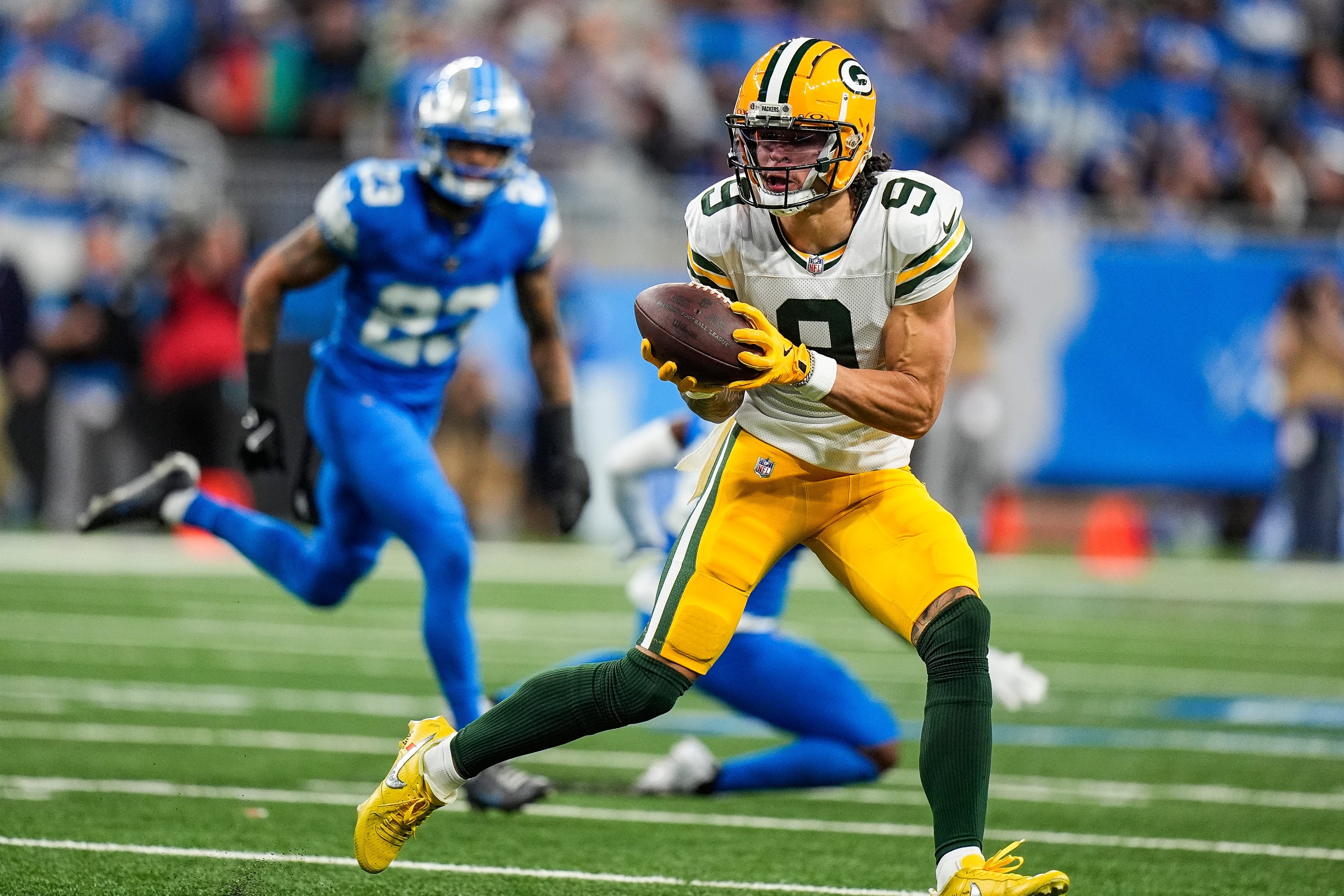 Green Bay Packers wide receiver Christian Watson (9) makes a catch against Detroit Lions during the first half at Ford Field in Detroit on Thursday, Dec. 5, 2024. © Junfu Han / USA TODAY NETWORK via Imagn Images