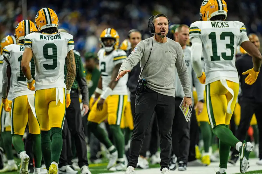 Green Bay Packers head coach Matt LaFleur slaps hands with players after the offense scores a touchdown against the Detroit Lions, during the Thursday Night Football at Ford Field in Detroit on Thursday, Dec. 5, 2024.