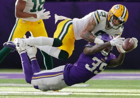 Minnesota Vikings cornerback Parry Nickerson (35) and Green Bay Packers wide receiver Christian Watson (9)