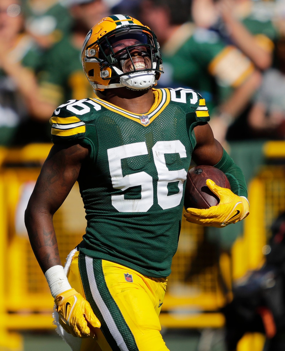 Green Bay Packers linebacker Edgerrin Cooper (56) celebrates recovering a fumble against the Minnesota Vikings during their football game Sunday, September 29, 2024, at Lambeau Field in Green Bay, Wisconsin. © Dan Powers/USA TODAY NETWORK-Wisconsin / USA TODAY NETWORK via Imagn Images