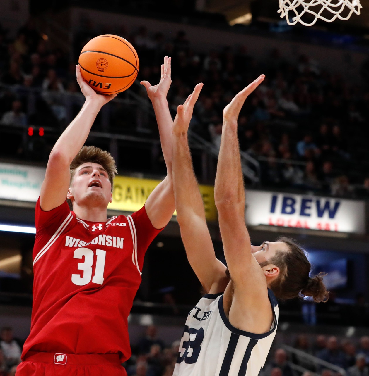 Wisconsin Badgers forward Nolan Winter (31) shooting the ball