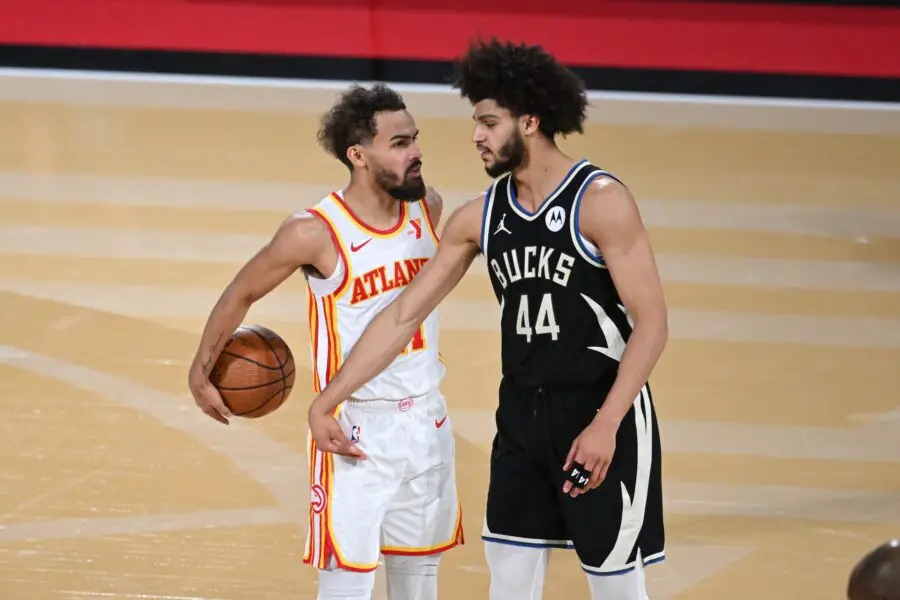 Dec 14, 2024; Las Vegas, Nevada, USA; Atlanta Hawks guard Trae Young (11) and Milwaukee Bucks guard Andre Jackson Jr. (44) react during the fourth quarter in a semifinal of the 2024 Emirates NBA Cup at T-Mobile Arena. Mandatory Credit: Candice Ward-Imagn Images