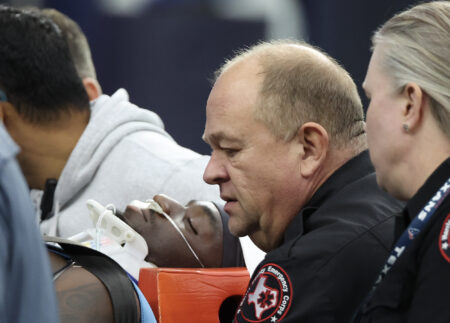 Dec 15, 2024; Houston, Texas, USA; Miami Dolphins wide receiver Grant DuBose (88) is taken off the filed by the medical team after he was injured during the third quarter against the Houston Texans at NRG Stadium. Mandatory Credit: Thomas Shea-Imagn Images