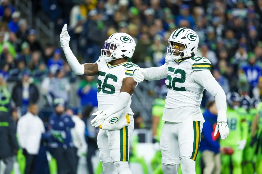 Dec 15, 2024; Seattle, Washington, USA; Green Bay Packers linebacker Edgerrin Cooper (56) celebrates with defensive end Rashan Gary (52) following a sack against the Seattle Seahawks during the first quarter at Lumen Field. Mandatory Credit: Joe Nicholson-Imagn Images