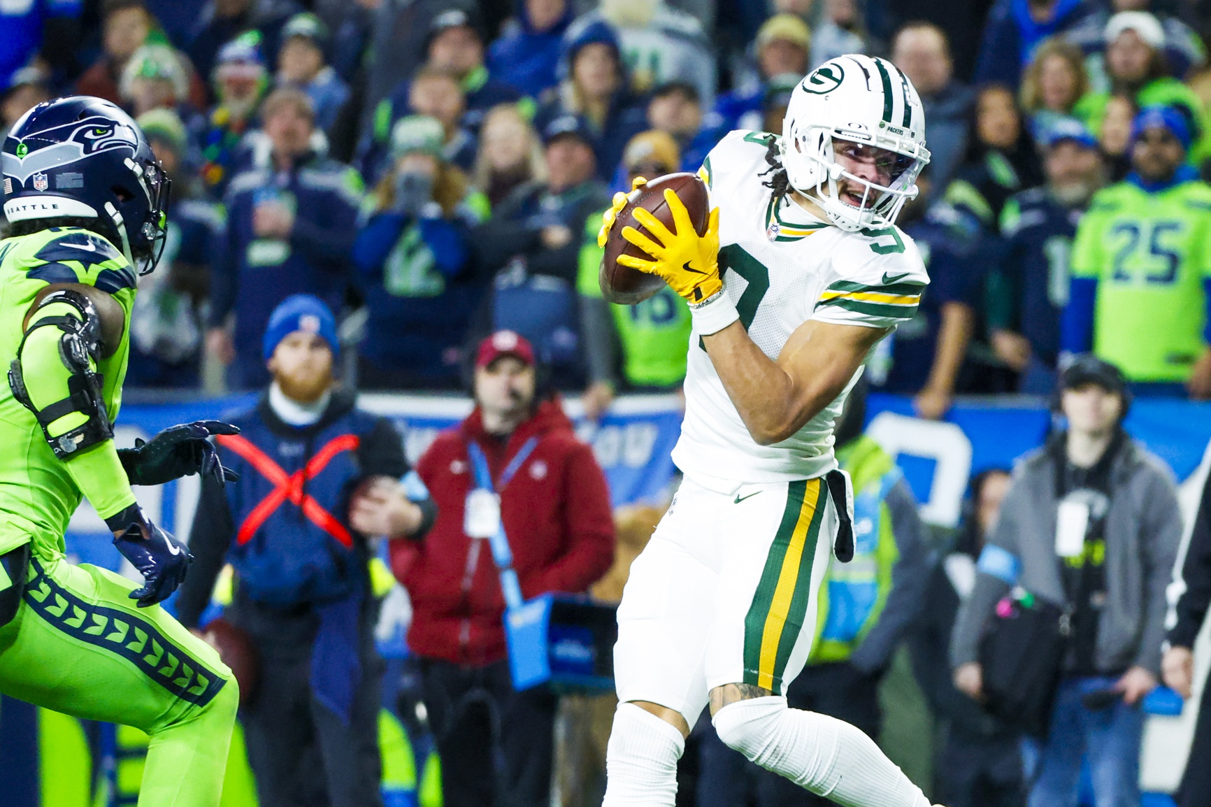 Dec 15, 2024; Seattle, Washington, USA; Green Bay Packers wide receiver Christian Watson (9) catches a pass against the Seattle Seahawks during the third quarter at Lumen Field. Mandatory Credit: Joe Nicholson-Imagn Images